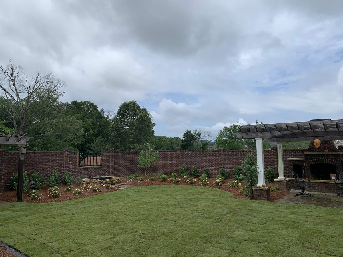 Courtyard design with pergola and outdoor fireplace